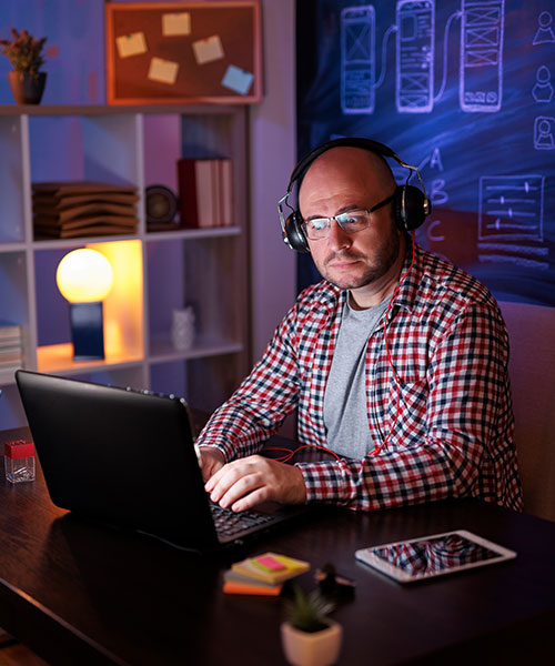 Man looking at website of Creative Omega